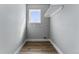 Functional laundry room with hardwood floors and utility connections at 1524 Ingalls St, Lakewood, CO 80214