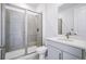 Clean bathroom with glass enclosed shower, white vanity, and modern fixtures at 9382 Quaker St, Arvada, CO 80007