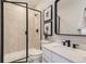 Bathroom with glass-enclosed shower and modern sink at 9382 Quaker St, Arvada, CO 80007