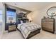 Bedroom with a stylish design featuring dual nightstands and natural light at 9382 Quaker St, Arvada, CO 80007