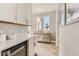 Convenient butler pantry with ample counter space and storage, perfect for entertaining at 9382 Quaker St, Arvada, CO 80007