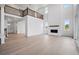 Bright living room with soaring ceilings, a modern fireplace, and large windows, creating an airy and inviting space at 9382 Quaker St, Arvada, CO 80007