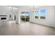 Bright and airy living room featuring light wood floors and expansive windows with scenic views at 9382 Quaker St, Arvada, CO 80007