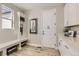 Entryway and mudroom featuring storage, bench seating, and natural light at 9382 Quaker St, Arvada, CO 80007