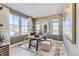 Inviting home office space filled with light, a neutral palette, and stylish decor at 9382 Quaker St, Arvada, CO 80007