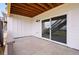 Private outdoor patio featuring concrete flooring, light and sliding glass doors at 9382 Quaker St, Arvada, CO 80007