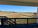 View from the rear deck that overlooks open land and rolling hills at 9382 Quaker St, Arvada, CO 80007