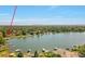 Picturesque lakefront home with boat docks and scenic views of the city skyline in the distance at 4790 W Evans Ave, Denver, CO 80219