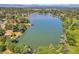 Wide view showing the lake with mountain views in the distance and the houses surrounding it at 4790 W Evans Ave, Denver, CO 80219