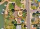 Lakefront home featuring a circular driveway and mature trees, offering privacy and convenience at 4790 W Evans Ave, Denver, CO 80219