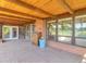 Covered back porch constructed of brick and wood overlooking property at 4790 W Evans Ave, Denver, CO 80219