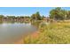 Lake view of water with homes and docks visible in the distance at 4790 W Evans Ave, Denver, CO 80219
