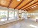 Bright living room with wood ceiling, skylights, fireplace and large windows with lake views at 4790 W Evans Ave, Denver, CO 80219