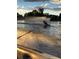 Personal water skiing on the lake at sunset, view from the boat at 4790 W Evans Ave, Denver, CO 80219