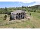 Beautiful two-story home with a fenced in yard and lush green landscaping at 4002 Bell Mountain Dr, Castle Rock, CO 80104
