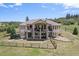 Beautiful two-story home with a fenced in yard and lush green landscaping at 4002 Bell Mountain Dr, Castle Rock, CO 80104
