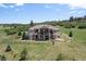 Beautiful two-story home with a fenced in yard and lush green landscaping at 4002 Bell Mountain Dr, Castle Rock, CO 80104