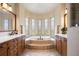 Elegant bathroom with a soaking tub and dual vanities, offering a luxurious spa-like experience at 4002 Bell Mountain Dr, Castle Rock, CO 80104