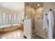 Elegant bathroom featuring a soaking tub, walk-in shower, and luxurious finishes at 4002 Bell Mountain Dr, Castle Rock, CO 80104