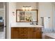 Bathroom with marble countertop, undermount sink, and a large mirror with recessed lighting at 4002 Bell Mountain Dr, Castle Rock, CO 80104