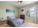Bright bedroom features neutral paint, ceiling fan, and large window for ample natural light with views at 4002 Bell Mountain Dr, Castle Rock, CO 80104