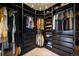 Walk-in closet with custom shelves, drawers, and ample storage space at 4002 Bell Mountain Dr, Castle Rock, CO 80104