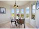 Cozy dining area features scenic views and a modern light fixture at 4002 Bell Mountain Dr, Castle Rock, CO 80104