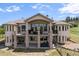 Expansive two-story home with a large balcony and stone pillar supports at 4002 Bell Mountain Dr, Castle Rock, CO 80104