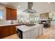 Modern kitchen with stainless steel appliances, a center island, and a gas cooktop at 4002 Bell Mountain Dr, Castle Rock, CO 80104