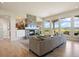 Open-concept living room boasts a fireplace, hardwood floors, and views at 4002 Bell Mountain Dr, Castle Rock, CO 80104