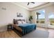 Bedroom with scenic views from large windows, and a ceiling fan for maximum comfort at 4002 Bell Mountain Dr, Castle Rock, CO 80104