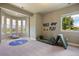 Bright playroom with large windows offering scenic views and ample space for activities at 4002 Bell Mountain Dr, Castle Rock, CO 80104
