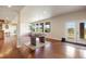 Spacious recreation room with foosball table, hardwood floors, and large windows providing natural light at 4002 Bell Mountain Dr, Castle Rock, CO 80104