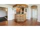 Finished basement with wet bar area featuring cabinetry, lighting, and bar stool seating at 4002 Bell Mountain Dr, Castle Rock, CO 80104