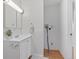 Compact, bright bathroom with vanity and sink, with room for a washer/dryer at 9650 Huron St # 12, Thornton, CO 80260