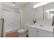 Clean, white bathroom features a tiled shower, toilet, and vanity sink at 9650 Huron St # 12, Thornton, CO 80260