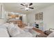 Spacious living room with hardwood floors, modern decor, and an open concept kitchen with breakfast bar at 9650 Huron St # 12, Thornton, CO 80260