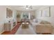 Spacious living room with hardwood floors, large windows, and contemporary decor at 9650 Huron St # 12, Thornton, CO 80260