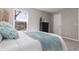 Bright bedroom features a large window, soft gray carpeting, and a cozy, inviting atmosphere at 10001 E Evans Ave # 72C, Aurora, CO 80247