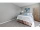 Serene bedroom with plush carpeting, a calming blue accent, and a decorative natural element at 10001 E Evans Ave # 72C, Aurora, CO 80247