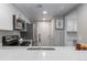 A closer view of the kitchen, featuring updated appliances at 10001 E Evans Ave # 72C, Aurora, CO 80247