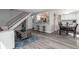 Inviting living room showcasing sleek gray floors, a modern staircase, and an open flow to the kitchen at 10001 E Evans Ave # 72C, Aurora, CO 80247