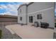 Backyard featuring concrete patio and gray siding at 5201 Lumos Ln, Castle Rock, CO 80104