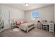 Bedroom featuring natural light, carpet and a desk for doing homework at 5201 Lumos Ln, Castle Rock, CO 80104