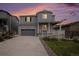 Charming two-story home with stone accents, a covered porch, and well-maintained landscaping at 5201 Lumos Ln, Castle Rock, CO 80104