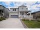 Charming two-story home with stone accents, a covered porch, and well-maintained landscaping at 5201 Lumos Ln, Castle Rock, CO 80104