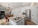 Open kitchen with granite countertops, stainless steel appliances, and a view of the dining area at 5201 Lumos Ln, Castle Rock, CO 80104