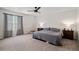 Serene main bedroom with a ceiling fan, neutral tones, and plenty of natural light at 5201 Lumos Ln, Castle Rock, CO 80104