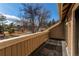 An outdoor deck/balcony offering an open-air view of the surrounding neighborhood and mature trees at 10291 E Powers Ave, Greenwood Village, CO 80111