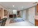 Open basement area with staircase, plush carpet, and ample storage space in a neutral color palette at 10291 E Powers Ave, Greenwood Village, CO 80111